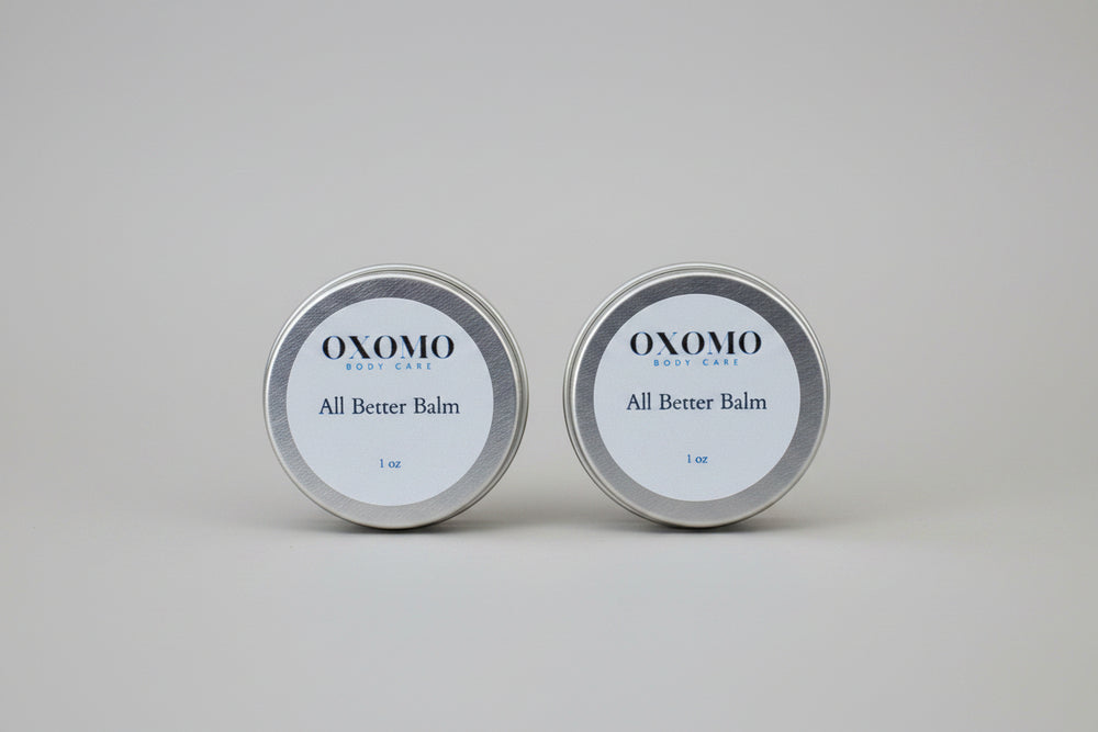 Two containers of OXOMO All Better Balm 